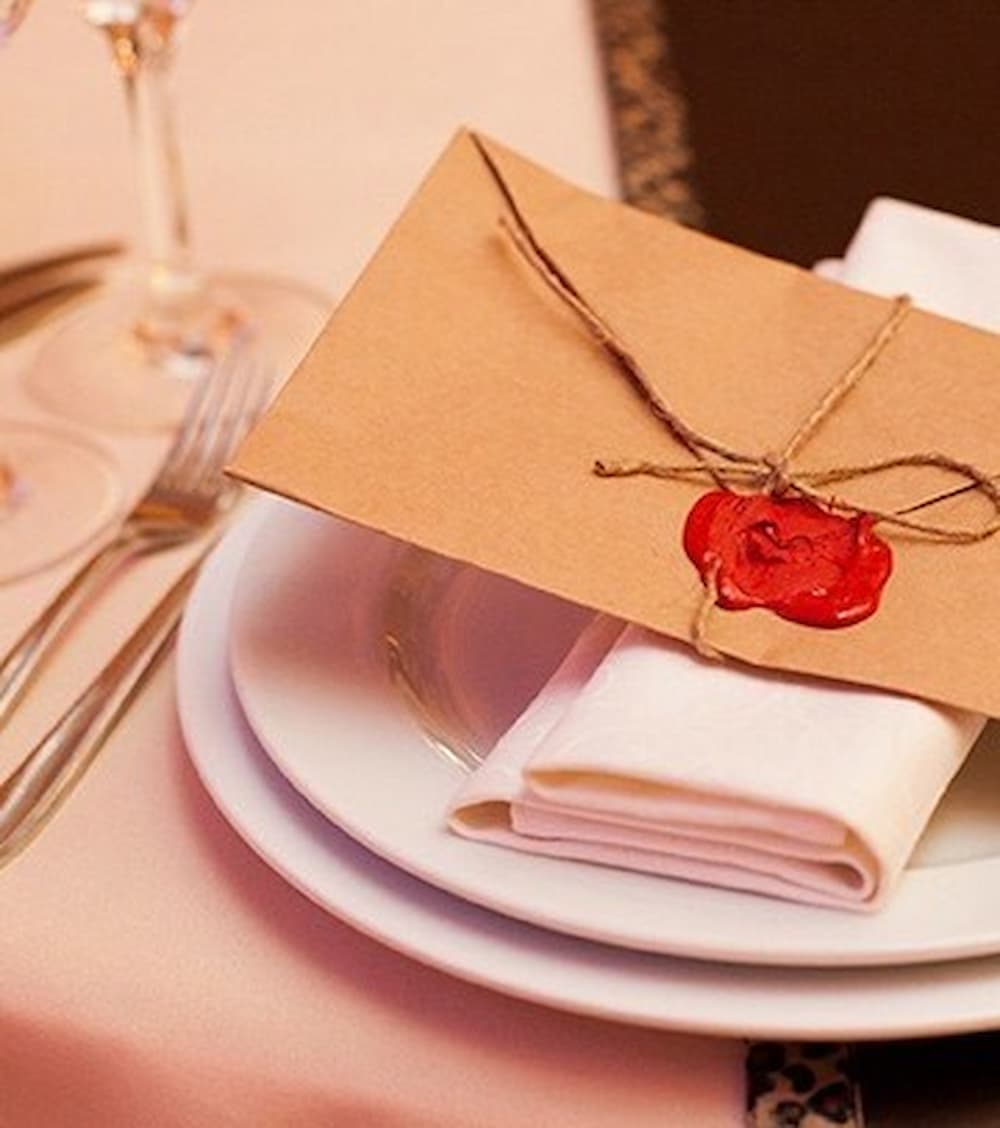 Our wedding planning team discussing celebration details with a couple